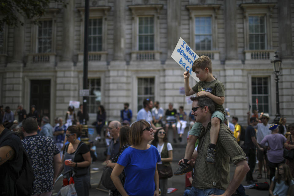 Anti-Brexit protestors from "Stop the Coup" Movement continue to protest outside the Downing Street in central London, Saturday, Aug. 31, 2019. Political opposition to Prime Minister Boris Johnson's move to suspend Parliament is crystalizing with protests around Britain and a petition to block the move gaining more than 1 million signatures. (AP Photo/Vudi Xhymshiti)