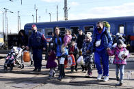 FILE - Refugees fleeing conflict from neighboring Ukraine arrive to Zahony, Hungary, Feb. 27, 2022. Hungary’s right-wing nationalist prime minister, Viktor Orban, has nurtured close political and economic ties with Russia for more than a decade. But following Russia's large-scale invasion of Ukraine, Hungary's neighbor, Orban is facing growing pressure to change course. (AP Photo/Anna Szilagyi, File)