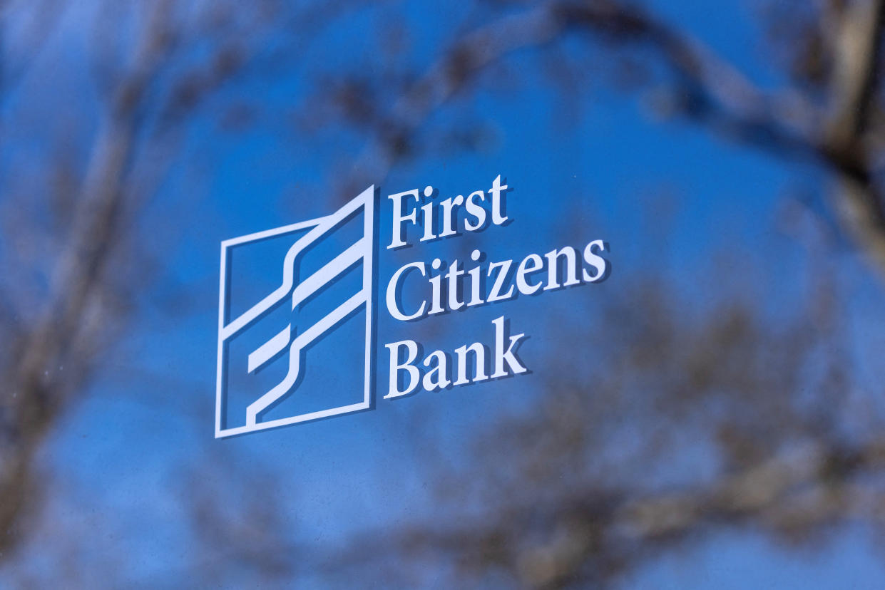 A general view of First Citizens Bank name an logo, after U.S. regulators said on Monday they would backstop a deal for regional lender First Citizens to acquire failed Silicon Valley Bank, triggering an estimated $20 billion hit to a government insurance fund, in Solana Beach, California, U.S., March 27, 2023.        REUTERS/Mike Blake