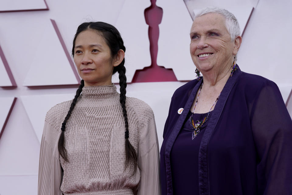 Chloe Zhao, left, and Charlene Swankie arrive at the Oscars on Sunday, April 25, 2021, at Union Station in Los Angeles. (AP Photo/Chris Pizzello, Pool)