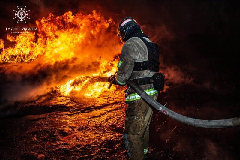 A firefighter battles flames ignited in the wake of a Russian drone strike against a gas station Saturday in Kharkiv, Ukraine. Seven died and three were wounded in the attack, officials said. Photo by Ukrainian Interior Ministry/Telegram