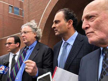 David Sidoo (2nd R) -- along with attorneys Richard Schonfeld (L), David Chesnoff and Martin Weinberg (R) -- speaks outside Boston federal court after pleading not guilty to charges of participating in the largest college admissions fraud scheme in U.S. history in Boston, Massachusetts, U.S. March 15, 2019. REUTERS/Ross Kerber