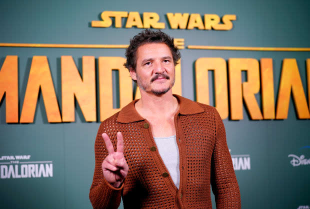 Who plays the Mandalorian? That would be Pedro Pascal, seen here during a photo call at Piccadilly Circus in London for "The Mandalorian" on Feb. 22, 2023<p><a href="https://www.gettyimages.com/detail/1247378636" rel="nofollow noopener" target="_blank" data-ylk="slk:Yui Mok - PA Images/Getty Images;elm:context_link;itc:0;sec:content-canvas" class="link ">Yui Mok - PA Images/Getty Images</a></p>