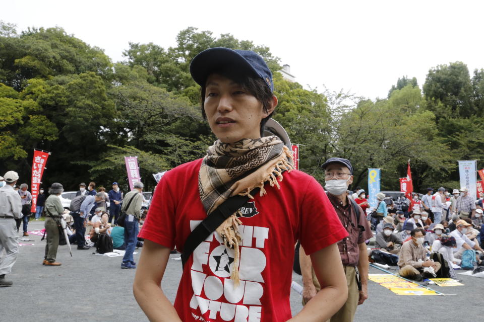 Mayumi Ishida, one of the protesters, speaks to media at a park during a protest against holding the state funeral for the former Prime Minister Shinzo Abe, in Tokyo, Japan Friday, Sept. 23, 2022. Several hundred protesters demanded the cancellation of Abe’s state funeral as they shouted slogans and waved banners Friday in a Tokyo park.(AP Photo/Yuri Kageyama)