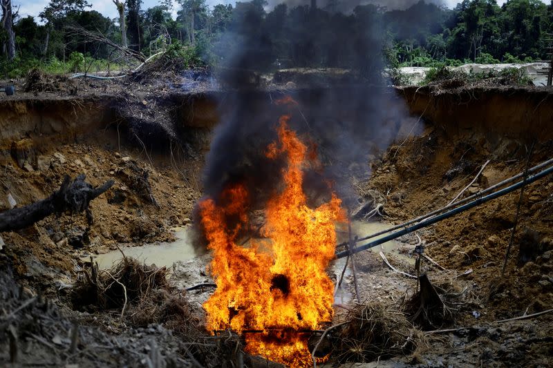 The Wider Image: Gold miners bring fresh wave of suffering to Brazil's Yanomami