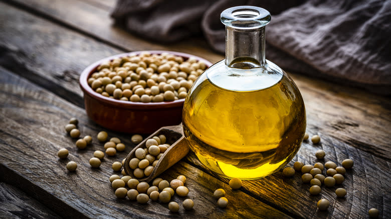 bottle of oil and soybeans