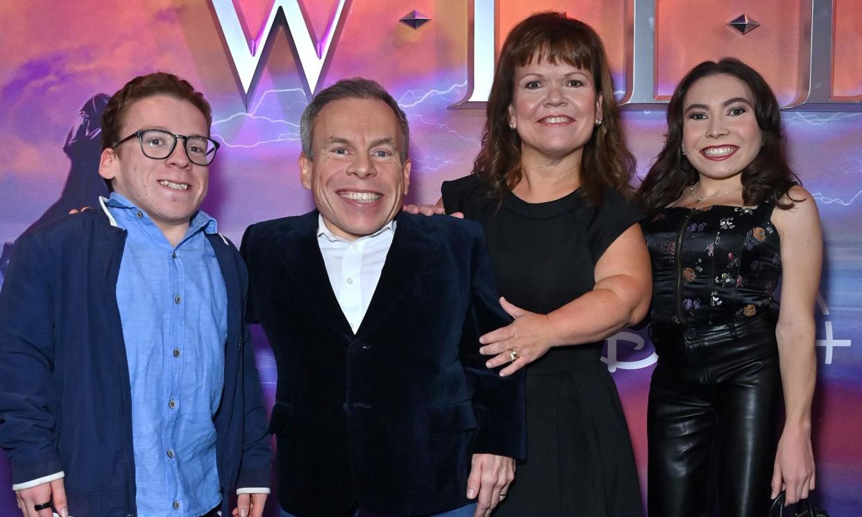 <span>Warwick Davis and his wife, Samantha, centre, with son Harrison, left, and daughter Annabelle in London in 2022.</span><span>Photograph: Anthony Harvey/Rex/Shutterstock</span>