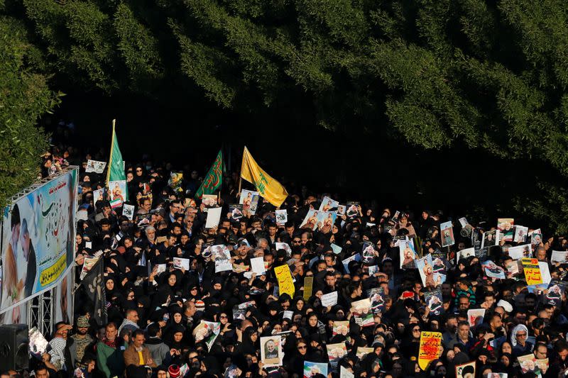 People attend a funeral procession for Soleimani and al-Muhandis, in Ahvaz