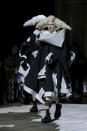A model wears a creation as part of the Comme des Garcons Fall/Winter 2023-2024 ready-to-wear collection presented Saturday, March 4, 2023 in Paris. (Scott Garfitt/Invision/AP)