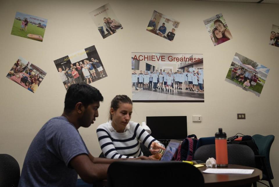 Effrosyni Chatzistogianni, an academic graduate assistant with the Aggie ACHIEVE program helps Matthew Philips, a junior in the program, during an office hours at the Texas A&M University campus in College Station on Nov. 15, 2022. Aggie ACHIEVE is a comprehensive transition program (CTP) for young adults with intellectual and developmental disabilities (IDD) who have exited high school.