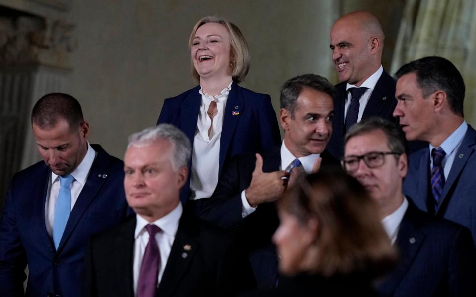 Liz Truss speaks with North Macedonia's Prime Minister Dimitar Kovacevski, top right, at a group photo during a meeting of the European Political Community at Prague Castle in Prague - Alastair Grant/AP