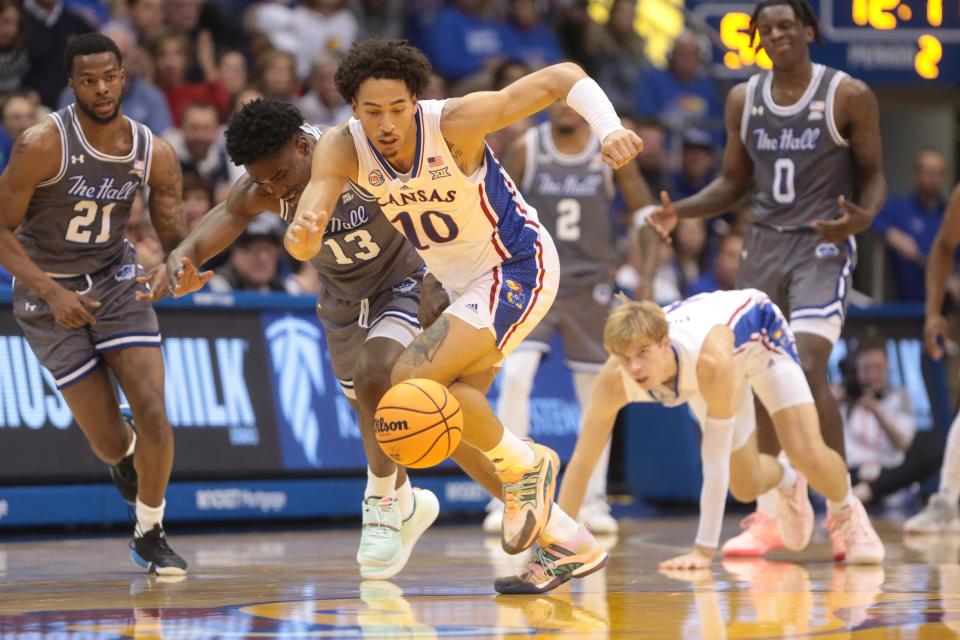 Kansas redshirt junior forward Jalen Wilson (10) chases after a loose ball during the second half of a game earlier this month against Seton Hall inside Allen Fieldhouse.