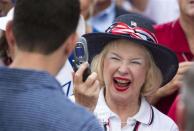 A supporter of Paul Ryan takes his photo as he works the rope line during during a campaign event at The Villages in Lady Lake, Florida August 18, 2012.