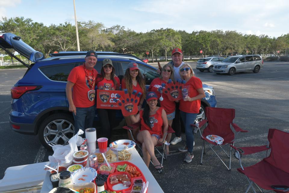 Panthers fan Bryce Simpson poses with family and friends as they tail-gate ahead of the Panthers watch party at Amerant Bank Arena (June 21, 2024).