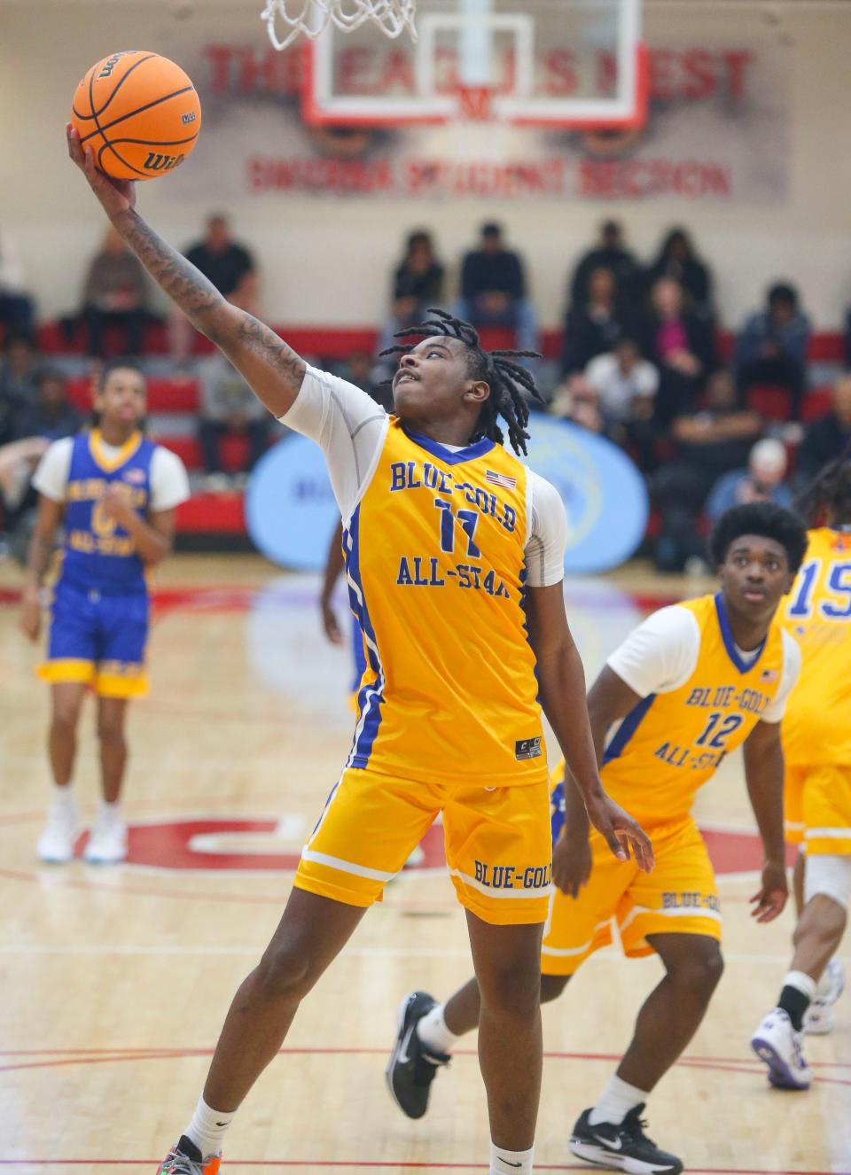 Gold's Isaiah Ayers of Sussex Tech snares a rebound in the Blue-Gold All Star high school senior game at Smyrna High School, Saturday, March 16, 2024.