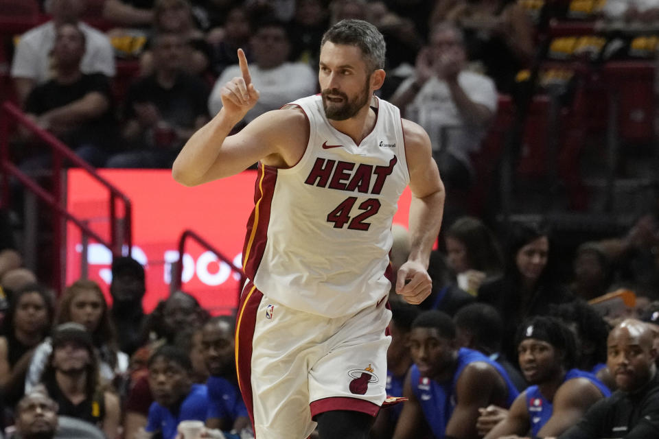 Miami Heat forward Kevin Love (42) gestures after scoring a three-point-shot during the first half of an NBA basketball game against the Detroit Pistons, Wednesday, Oct. 25, 2023, in Miami. (AP Photo/Marta Lavandier)