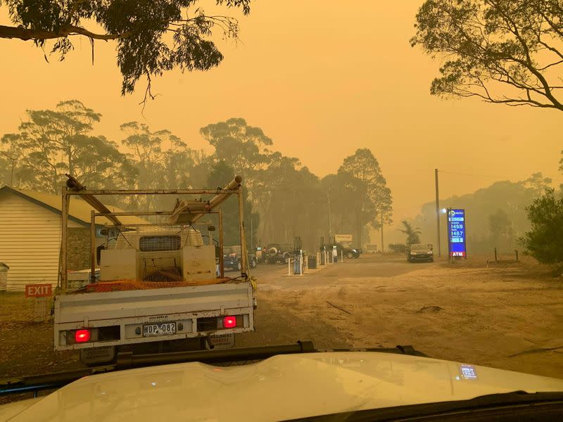 Cars queue up for petrol at a gas station in Bega Valley, New South Wales