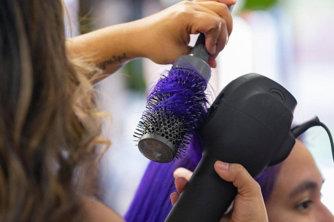 Stylist Serena Garcia blow drys the hair of her client Alba Contreras during an appointment at Magnolia Ave. Salon in Fort Worth, Texas, on Saturday, Sept. 10, 2022.