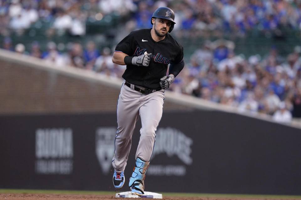 Miami Marlins' Adam Duvall runs the bases after hitting a grand slam during the third inning of the team's baseball game against the Chicago Cubs in Chicago, Friday, June 18, 2021. (AP Photo/Nam Y. Huh)