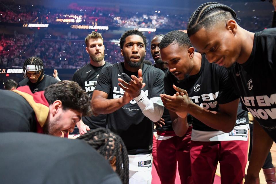 Cleveland Cavaliers' Donovan Mitchell, center, celebrates with teammates before Game 1 in the first round of the NBA basketball playoffs against the New York Knicks, Saturday, April 15, 2023, in Cleveland. (AP Photo/Nick Cammett)