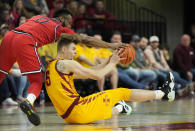 St. John's guard Posh Alexander (0) and Iowa State forward Aljaz Kunc (5) battle for the ball at mid court during the first half of an NCAA college basketball game, Sunday, Dec. 4, 2022, in Ames, Iowa. (AP Photo/ Matthew Putney)