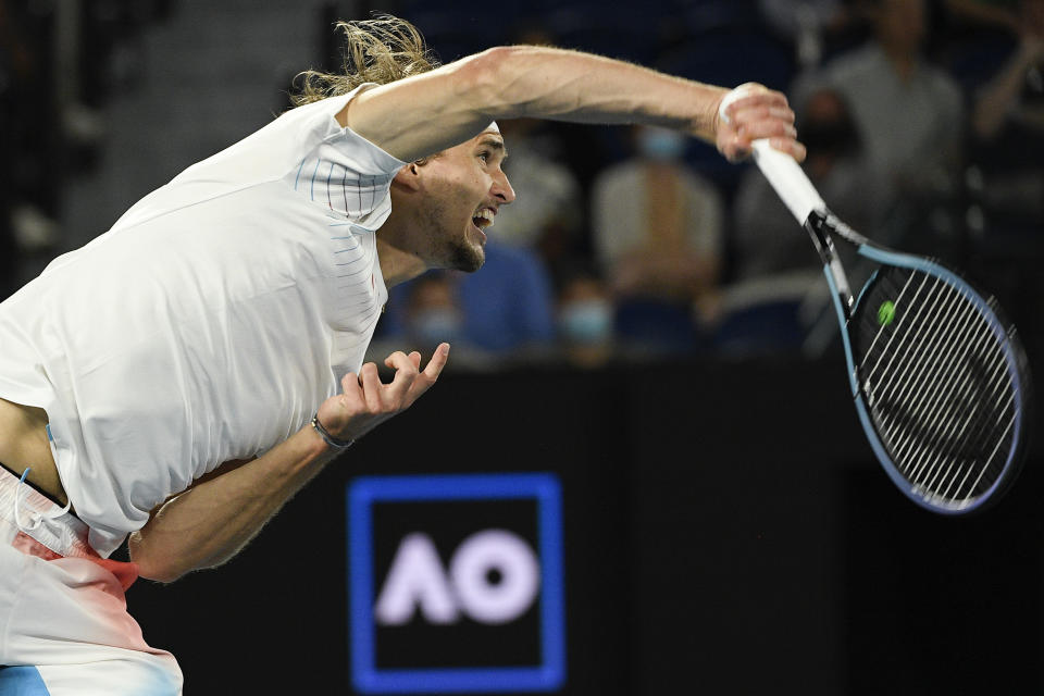 Alexander Zverev of Germany serves to John Millman of Australia during their second round match at the Australian Open tennis championships in Melbourne, Australia, Wednesday, Jan. 19, 2022. (AP Photo/Andy Brownbill)