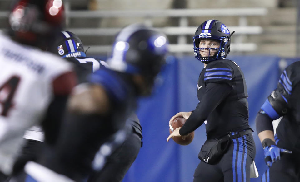 BYU quarterback Zach Wilson (1) looks to throw the ball in the first half of an NCAA college football game against San Diego State Saturday, Dec. 12, 2020, in Provo, Utah. (AP Photo/George Frey, Pool)