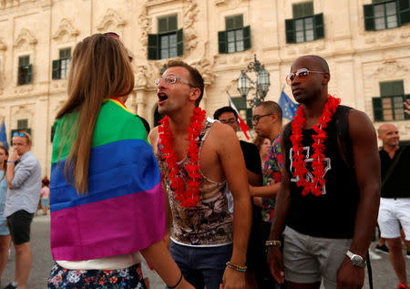 People celebrate after the Maltese parliament voted to legalise same-sex marriage on the Roman Catholic Mediterranean island, in Valletta, Malta July 12, 2017. REUTERS/Darrin Zammit Lupi