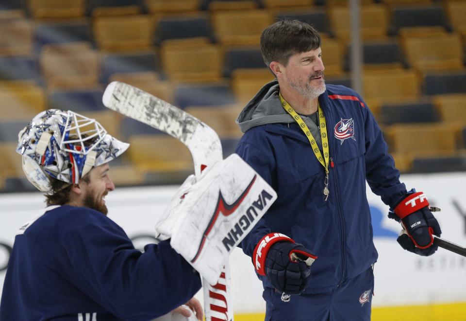 Columbus Blue Jackets assistant coach Brad Shaw jokes with goaltender Keith Kinkaid (1) during the morning skate prior to Game 2 of the NHL Eastern Conference semifinals against the Boston Bruins at TD Garden in Boston on Saturday, April 27, 2019. [Adam Cairns/Dispatch]