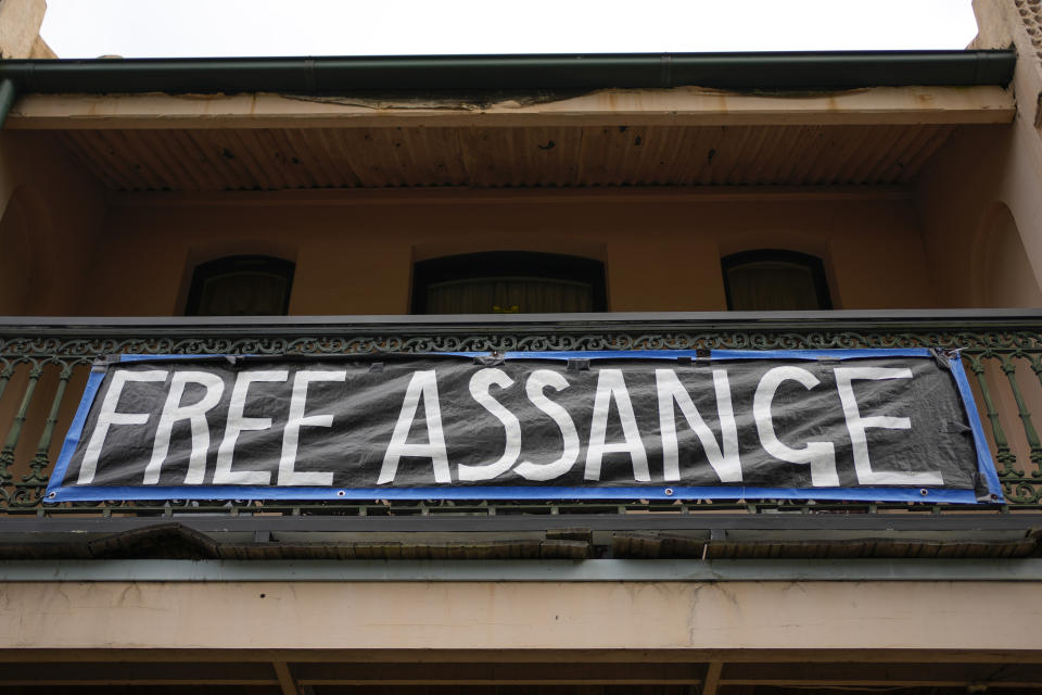 A sign in support of WikiLeaks founder Julian Assange hangs from the balcony of a house in Sydney, Australia, Monday, June 20, 2022. Australian Prime Minister Anthony Albanese on Monday rejected calls for him to publicly demand the United States drop its prosecution of WikiLeaks founder and Australian citizen Julian Assange.(AP Photo/Mark Baker)