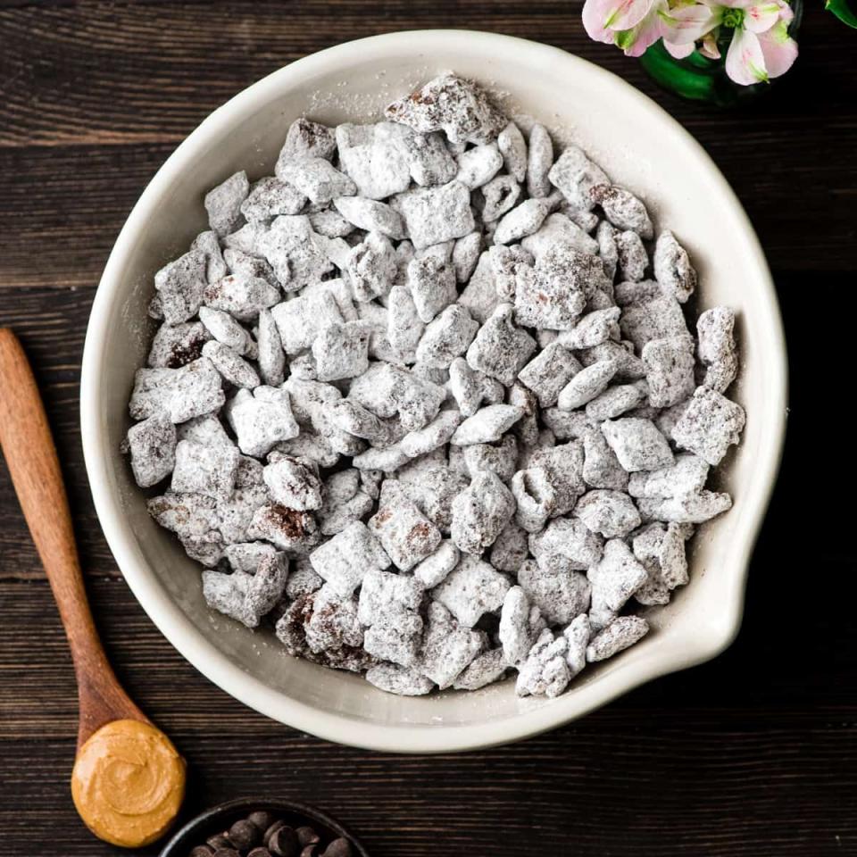 <p>Chex cereal, chocolate chips, peanut butter, and powdered sugar. That’s it. That’s the recipe. Make extra, because the bowl may not make it past the first quarter. </p><p><a href="https://joyfoodsunshine.com/puppy-chow-recipe/" rel="nofollow noopener" target="_blank" data-ylk="slk:Recipe from JoyFoodSunshine" class="link "><em>Recipe from JoyFoodSunshine</em></a></p>