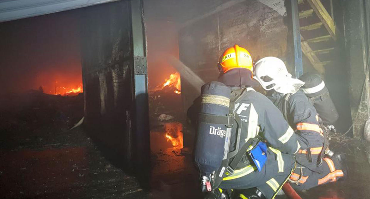 Firefighters battling the huge fire at 11 Kranji Crescent. (Photo: Facebook/SCDF)