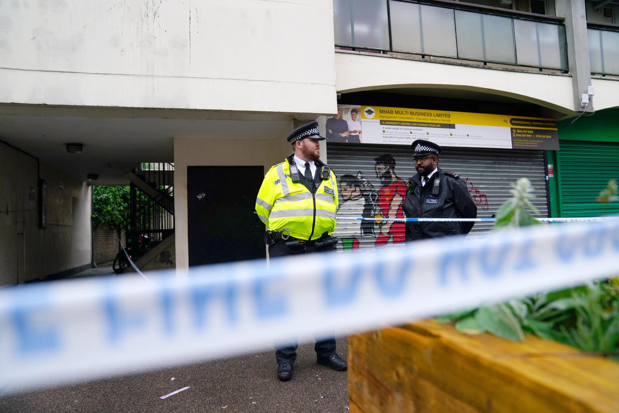 Police near to the scene in Lambeth, south London, where a 16-year-old boy died after being stabbed on Monday evening. Picture date: Tuesday July 6, 2021.