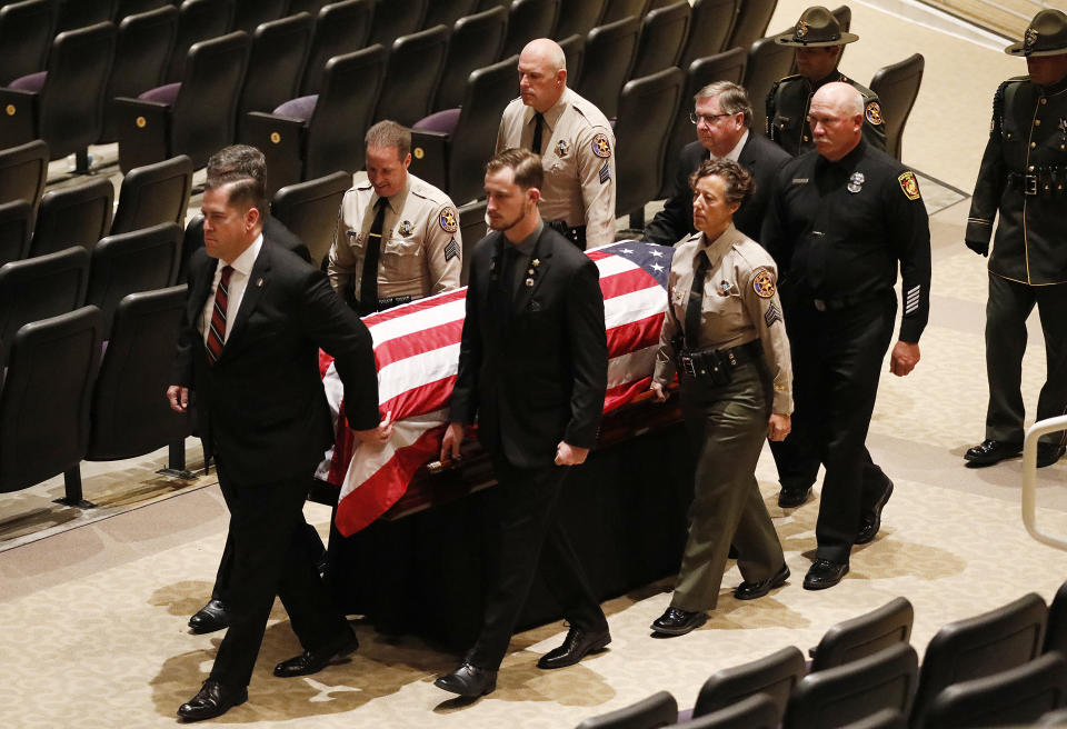 The casket with the body of Ventura County Sheriff Sgt. Ron Helus is carried out after a memorial service for Sgt. Helus at Calvary Community Church in Westlake Village, Calif., Thursday, Nov. 15, 2018. Sgt. Helus was one of twelve victims of the Borderline Bar & Grill mass shooting in Thousand Oaks last week. (Al Seib /Los Angeles Times via AP, Pool)