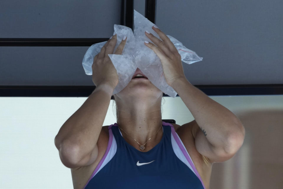 Aryna Sabalenka of Belarus cools down with bags of ice during a break in her fourth round match against Belinda Bencic of Switzerland during their fourth round match at the Australian Open tennis championship in Melbourne, Australia, Monday, Jan. 23, 2023. (AP Photo/Aaron Favila)