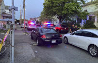 Authorities respond to the scene where multiple people were wounded in a shooting, Thursday, May 13, 2021, in Providence, R.I. (AP Photo/William J. Kole)