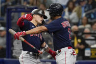 Boston Red Sox's Enrique Hernandez, left, celebrates his solo home run against the Tampa Bay Rayw with Xander Bogaerts (2) during the fifth inning in Game 2 of a baseball American League Division Series, Friday, Oct. 8, 2021, in St. Petersburg, Fla. (AP Photo/Steve Helber)