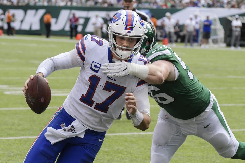 Buffalo Bills' Josh Allen (17) runs past New York Jets' Henry Anderson (96) for a touchdown during the second half of an NFL football game Sunday, Sept. 8, 2019, in East Rutherford, N.J. (AP Photo/Bill Kostroun)