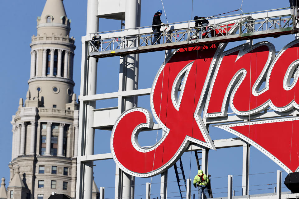 Workers begin to remove the large 