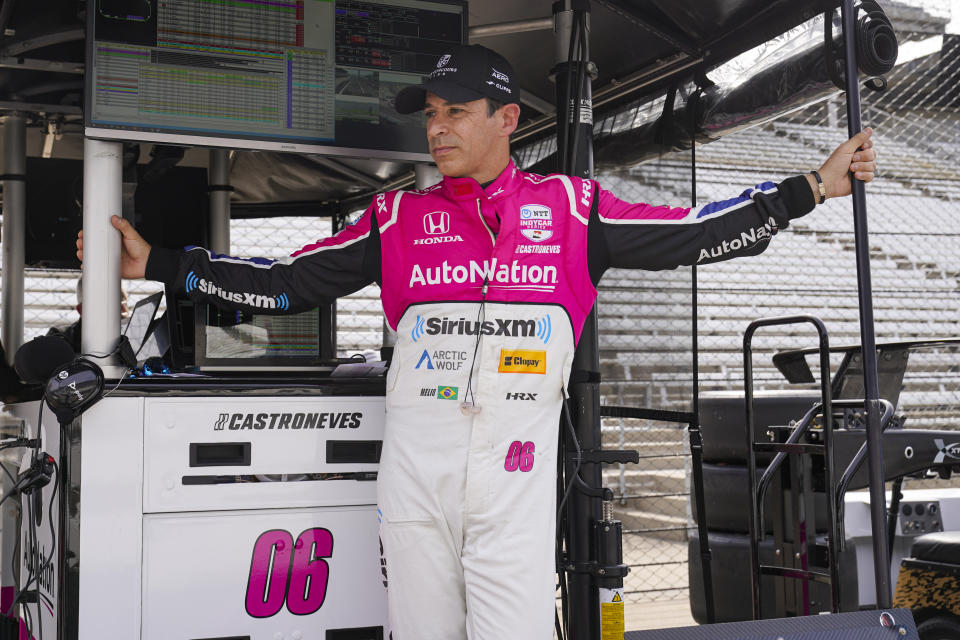 Helio Castroneves, of Brazil, waits for the start of an open test session for the Indianapolis 500 auto race at Indianapolis Motor Speedway in Indianapolis, Thursday, April 20, 2023. (AP Photo/Michael Conroy)