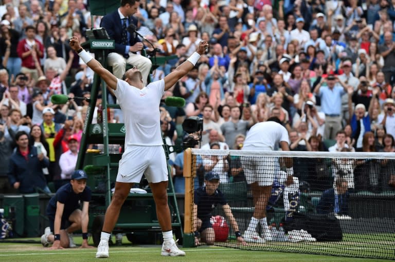 Marathon man: Rafael Nadal celebrates after beating Juan Martin del Potro