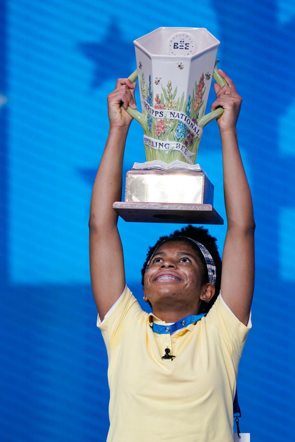 Zaila Avant-garde, 14, from Harvey, Louisiana, holds up the championship trophy after winning the finals of the 2021 Scripps National Spelling Bee at Disney World.