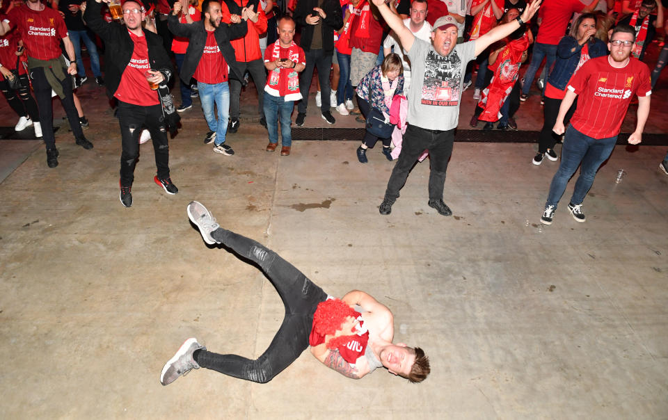 Liverpool celebrate Liverpool's Mohamed Salah scoring their sides first goal as the watch the UEFA Champions League Final at the M&S Bank Arena, Liverpool.