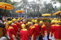 Pallbearers lift up the coffin of Vietnamese Buddhist monk Thich Nhat Hanh during his funeral in Hue, Vietnam Saturday, Jan. 29, 2022. A funeral was held Saturday for Thich Nhat Hanh, a week after the renowned Zen master died at the age of 95 in Hue in central Vietnam. (AP Photo/Thanh Vo)