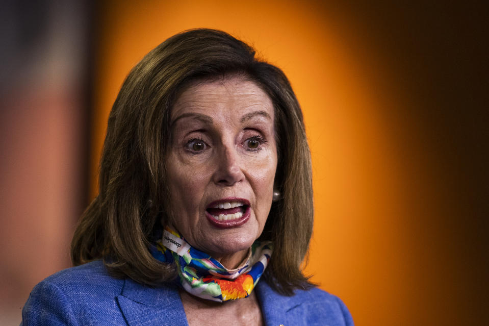 FILE - In this July 2, 2020, file photo House Speaker Nancy Pelosi of Calif., speaks during a news conference on Capitol Hill in Washington. At least 10 lawmakers and three congressional caucuses have ties to organizations that received federal coronavirus aid, according to government data released this week. Among businesses that received money was a hotel partially owned by the husband of Pelosi. (AP Photo/Manuel Balce Ceneta, File)