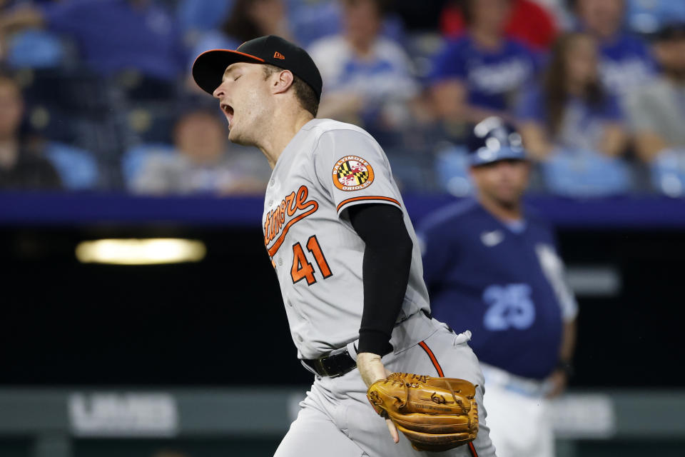 Baltimore Orioles third baseman Tyler Nevin reacts after dropping the ball while fielding a ground ball by Kansas City Royals' Carlos Santana during the fifth inning of a baseball game in Kansas City, Mo., Friday, June 10, 2022. Nevin was charged with an error on the play. (AP Photo/Colin E. Braley)