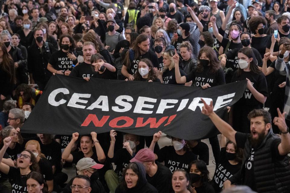 Protesters gather at Grand Central Terminal during a rally calling for a ceasefire between Israel and Hamas on Friday, Oct. 27, 2023, in New York. (AP Photo/Jeenah Moon)