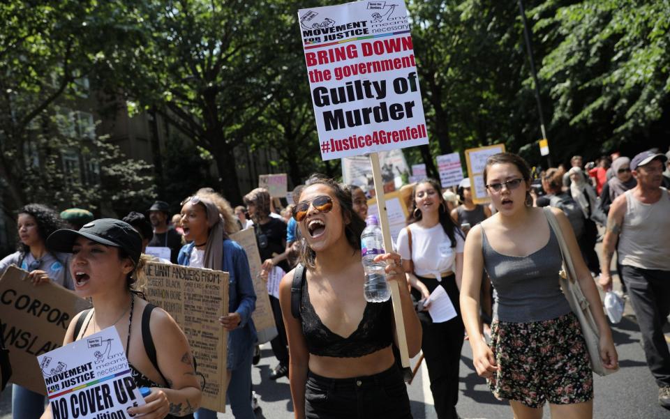 Protesters shout as they march to Westminster - Credit: Dan Kitwood/Getty