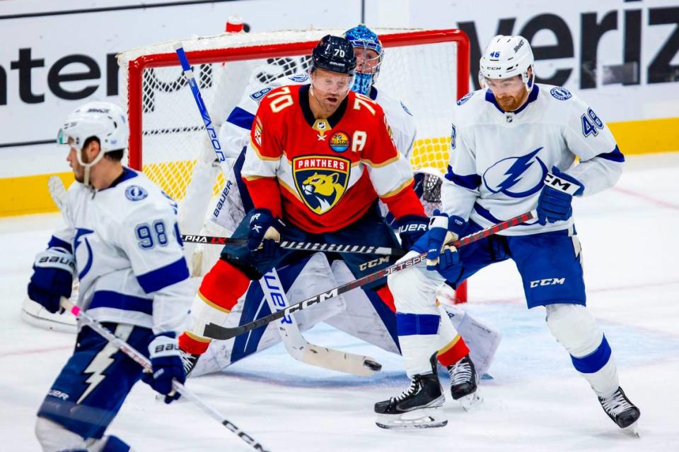 Florida Panthers right wing Patric Hornqvist (70) blocks Tampa Bay Lightning goalie Andrei Vasilevskiy (88) while defender Nick Perbix (48) attempts to deflect the shot during an NHL game at FLA Live Arena in Sunrise, Florida, on Friday, October 21, 2022.
