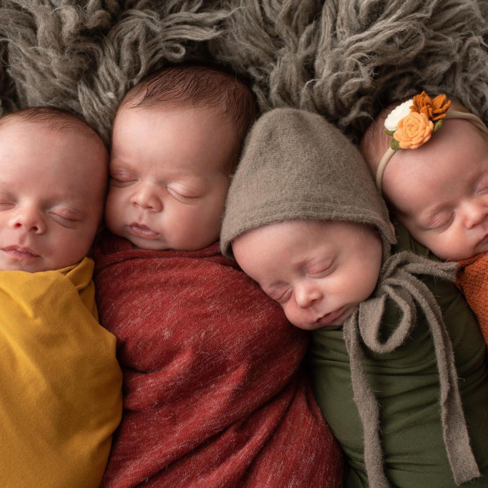 The quadruplets snuggled up for a photo. (Jan Stizel / Digital Dreamer Photography)